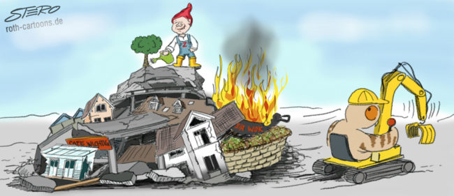 Cartoon-Karikatur-Comic---Auf einem Trümmerhaufen aus Gebäuden und Straßen gießt ein Heinzelmännchen mit einem Z auf der Brust einen Baum. Daneben fährt ein Uhu mit dem Bagger davon.
