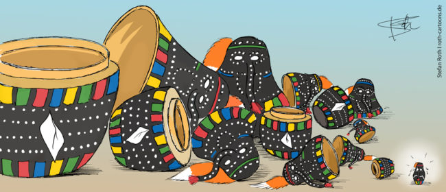 Cartoon-Karikatur-Comic---Matrjoschkas im Hänsele Design sind bis auf den kleinsten auseinander gesteckt und liegen auf dem Tisch.