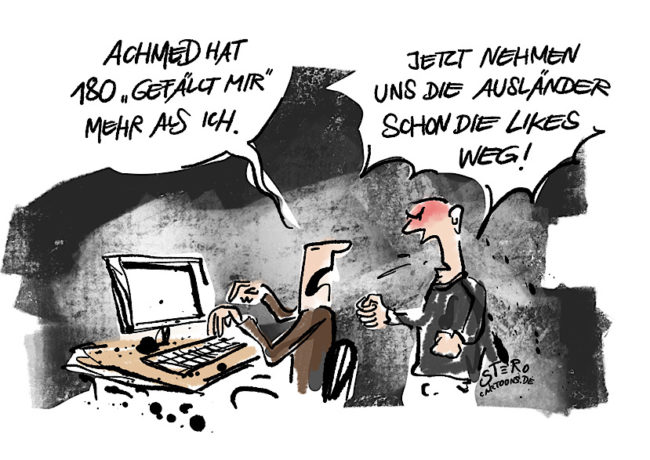 Cartoon über Rassismus und soziale Medien. Ein Rechter sitzt vor dem Computer und sagt: Achmed hat 180 gefällt-mir mehr als ich. Sein Kollege sagt: Jetzt nehmen uns die Ausländer schon die Likes weg!.