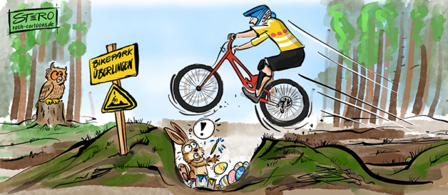 Cartoon-Karikatur-Comic: Ein Mountainbiker schanzt in einem Bikepark über eine Mulde und erschreckt den Osterhasen, der gerade dabei ist, Ostereier zu färben